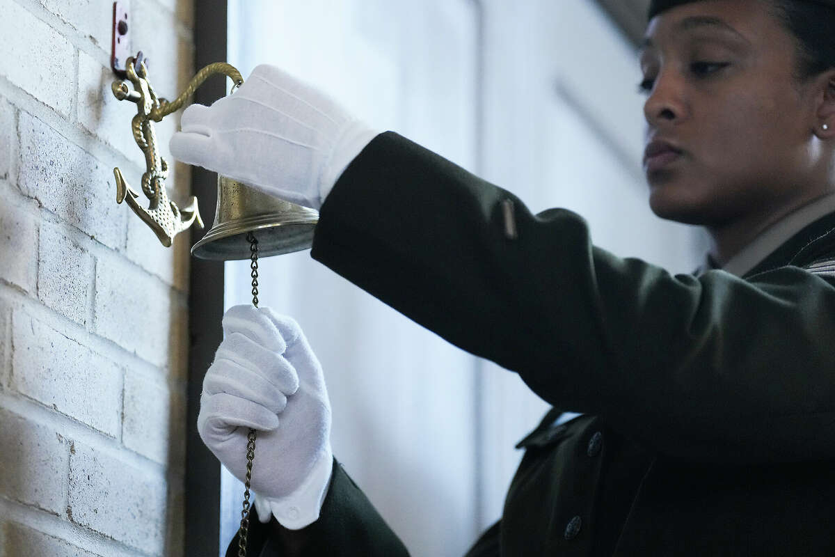 Sgt. Gabriela Corbalan rings a bell as the names of the soldiers from the 3rd Battalion, 24th Infantry Regiment, are read during an event at the Buffalo Soldiers Museum on Monday, Nov. 13, 2023 in Houston.