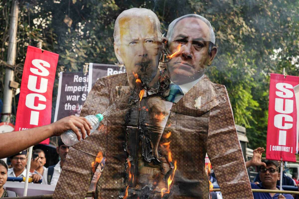 Palestinians and supporters sued President Joe Biden in San Francisco on Monday, accusing his administration of backing and funding genocide by Israel in Gaza. Activists burned effigies of the president and Israeli Prime Minister Benjamin Netanyahu in Kolkata, India, on Nov. 1.