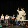 Detective Rufus Annette Biddle, played by Noah Maue (center) interrogates Jane Smith, played by Flynn Anderson (right), to determine her motive to murder Casanova Bond, played by Cady Brown (left), Nov. 13 during the Manistee Middle High School theater program's rehearsal for "Cooking Can be Murder."