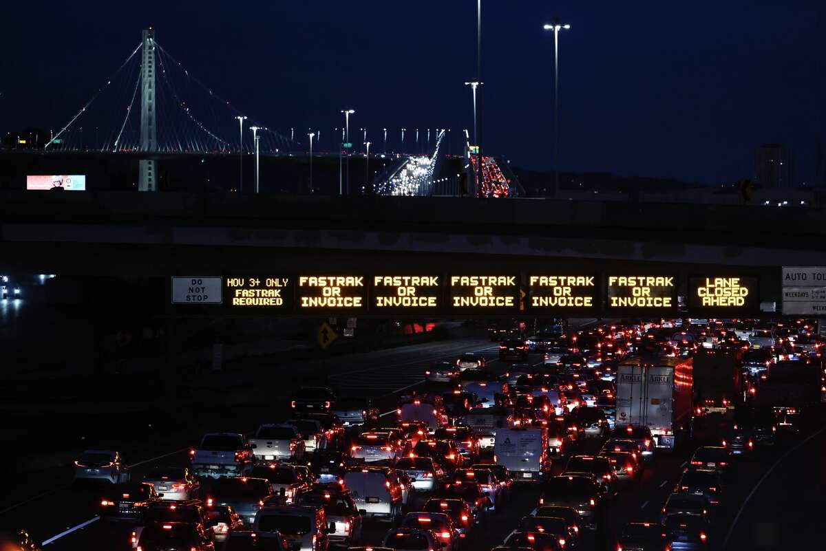 Traffic backs up at the Toll Plaza in Oakland, Calif. Tuesday, November 14, 2023 as California Highway Patrol close down the right lane of westbound I-80 on the Bay Bridge as a safety precaution for the Asia-Pacific Economic Cooperation summit being held in San Francisco.