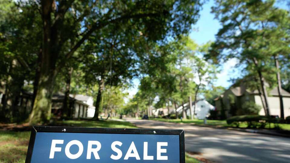 A real estate for sale sign is shown at a home Tuesday, Nov. 14, 2023, in Spring.