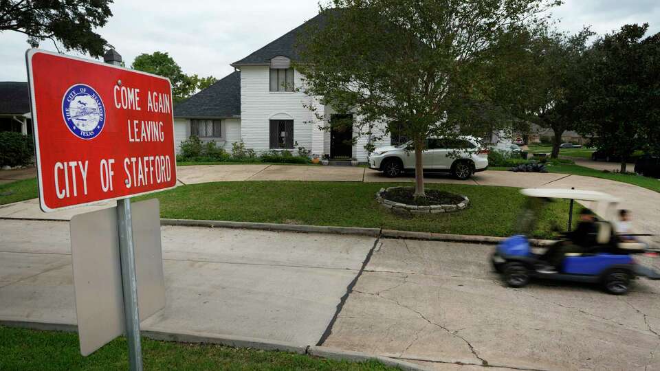 The condition of the street on Longview Dr. in the Sugar Creek subdivision changes from Sugar Land to Stafford shown Tuesday, Nov. 14, 2023, in Stafford. Property tax in Stafford was eliminated in 1995.