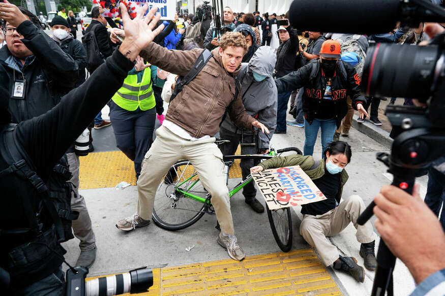 Protesters rally scuffle with police at Fifth and Mission Street during a demonstration against the 2023 Asia-Pacific Economic Coroperation (APEC) Economic Leaders' WEek and CEO Summit in San Francsico. Wednesday, Nov 15, 2023
