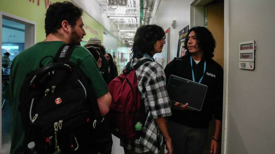 Israel Garcia, 17, and his classmates look for a classroom to study for an upcoming exam at Carnegie Vanguard High School on Thursday, Nov. 9, 2023, in Houston.