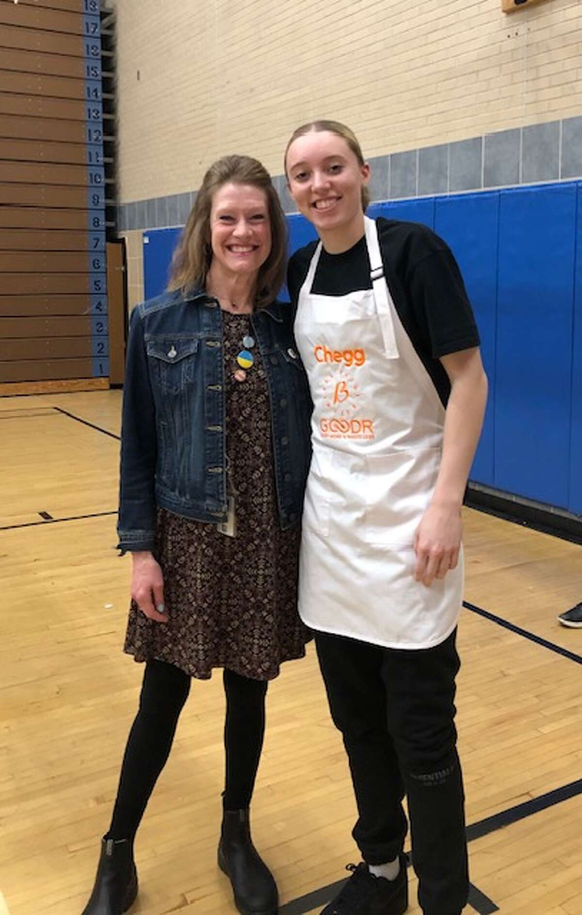 Paige Bueckers and her former seventh grade homeroom teacher at Hopkins West Middle School, Donna Philippot. Bueckers returned to the school and opened up a food pantry with Cheg this spring.