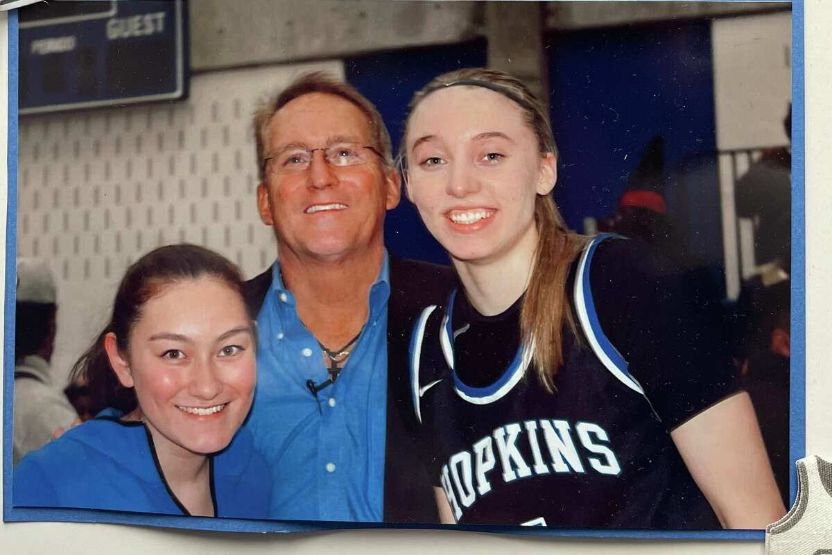 Brian Cosgriff with Paige Bueckers and his daughter. Bueckers played for Cosgriff at Hopkins High School and led the school to the 2019 state championship.