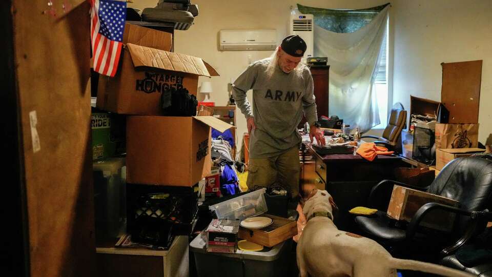 Army Veteran Ronald Payne packs his belongings in preparation for an eviction due to paperwork issues on Friday, Nov. 17, 2023, in Houston.