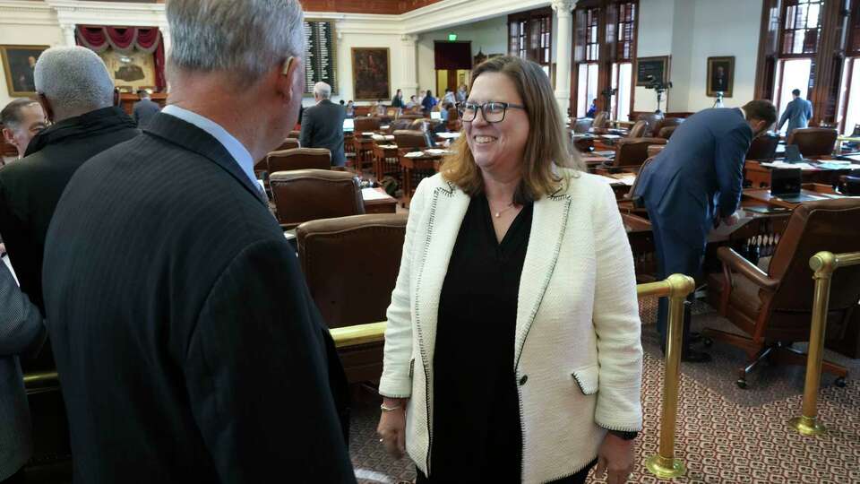 State Rep. Julie Johnson, D-Farmers Branch, smiles after the House voted, 84-63 to take off school vouchers from the HB1 spending bill on Friday, November 17, 2023.