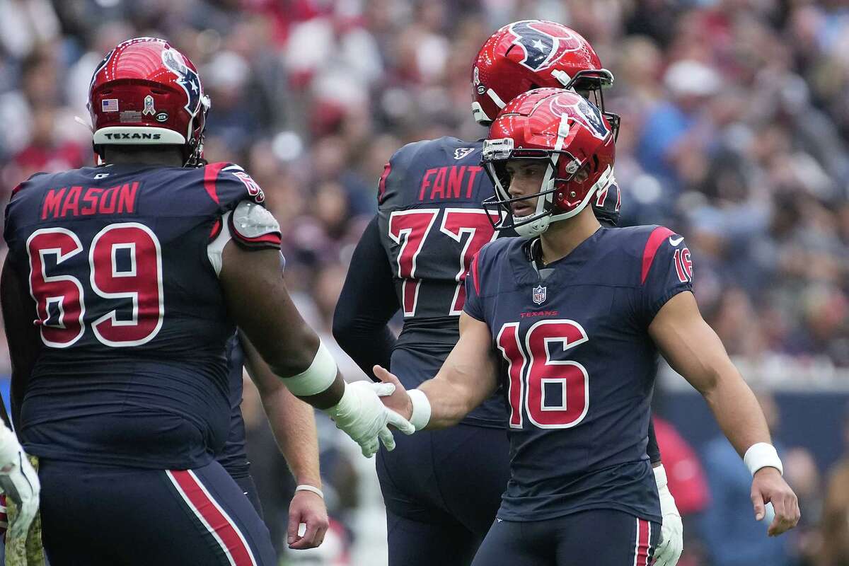 Houston Texans place kicker Matt Ammendola (16) is congratulated by Houston Texans guard Shaq Mason (69) after an extra point against the Arizona Cardinals in the first half of NFL game action at NRG Stadium on Sunday, Nov. 19, 2023 in Houston.