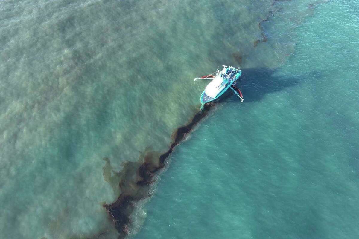 In this photo provided by the U.S. Coast Guard, a Clean Gulf Associates 95-foot response vessel skims crude oil approximately 4 miles southeast off South Pass Louisiana, Friday, Nov. 17, 2023. A Unified Command composed of the Coast Guard, Main Pass Oil Gathering Company, LLC, and the Louisiana Oil Spill Coordinator's Office is coordinating measures to assess, contain and mitigate the impact of the spill. (U.S. Coast Guard/Courtesy Clean Gulf Associates via AP)