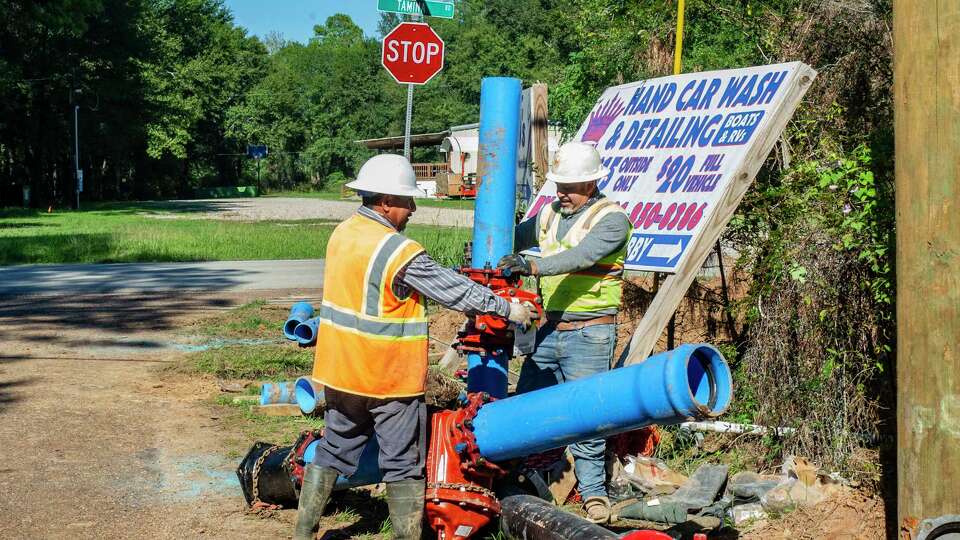 Construction personnel work with large sections of pipe as progress continues on Phase 1 of the Tamina water sewer project, Wednesday, Nov. 15, 2023, along Tamina Road near David Memorial Drive in Shenandoah.