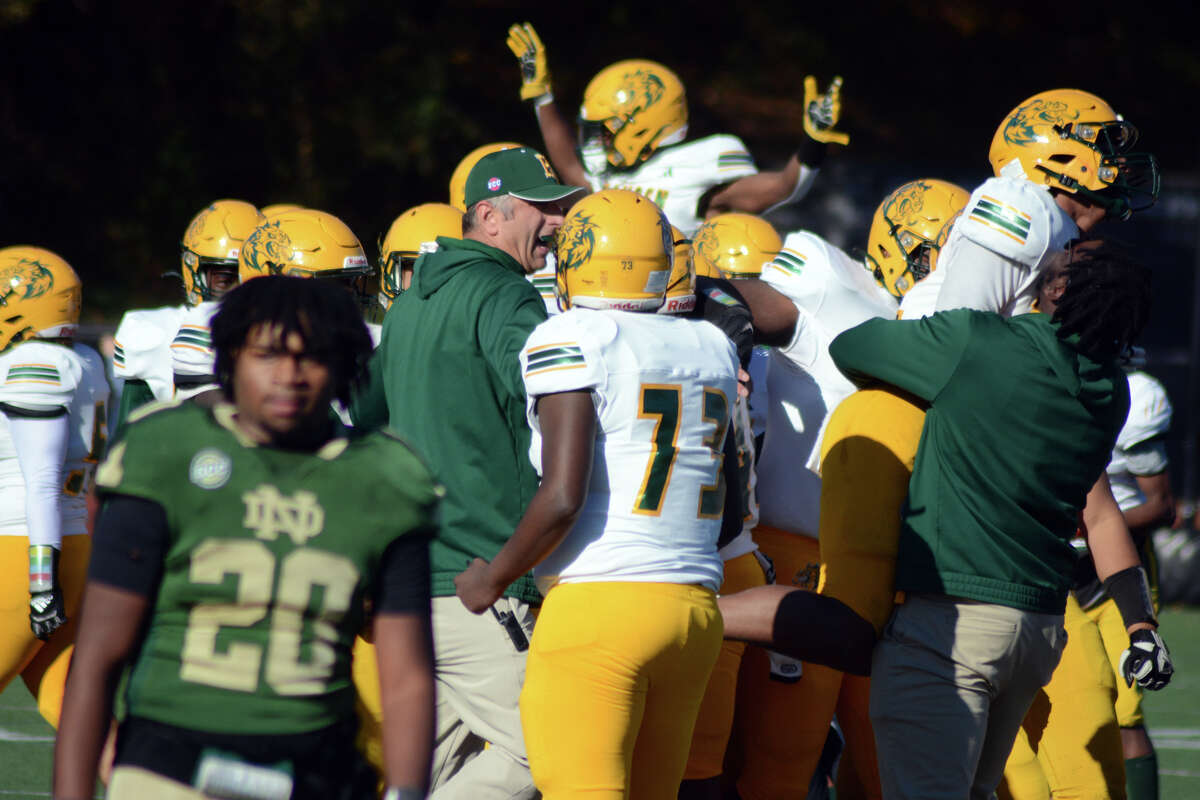 Hamden celebrates after the final whistle in the 72nd annual Green Bowl where the Green Dragons stunned Notre Dame-West Haven 21-17 on Thursday, Nov. 23, 2023.