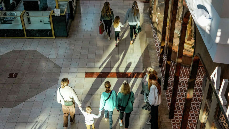 Shoppers inside The Woodlands Mall for Black Friday deals on Friday, Nov. 24, 2023, in The Woodlands.