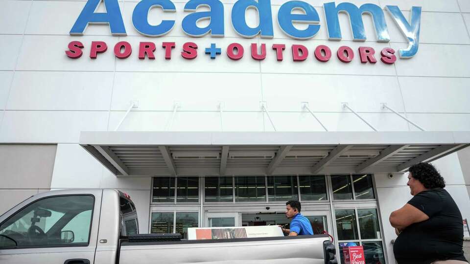 Rosa Laredo buys an outdoor heater at Academy on Friday, Nov. 24, 2023, in Houston.