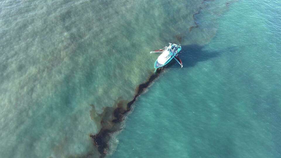 In this photo provided by the U.S. Coast Guard, a Clean Gulf Associates 95-foot response vessel skims crude oil approximately 4 miles southeast off South Pass Louisiana, Friday, Nov. 17, 2023. A Unified Command composed of the Coast Guard, Main Pass Oil Gathering Company, LLC, and the Louisiana Oil Spill Coordinator's Office is coordinating measures to assess, contain and mitigate the impact of the spill. (U.S. Coast Guard/Courtesy Clean Gulf Associates via AP)