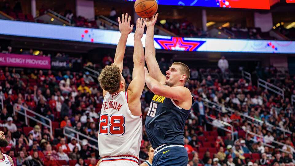 Denver Nuggets center Nikola Jokic (15) tries to put up a shot over Houston Rockets center Alperen Sengun (28) in the second half of an NBA basketball game, Friday, Nov. 24, 2023 at Toyota Center in. Houston.