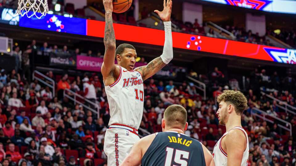 Houston Rockets forward Jabari Smith (10) pulls down a rebound in the second half of an NBA basketball game against Denver, Friday, Nov. 24, 2023 at Toyota Center in. Houston.