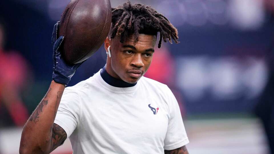 Houston Texans wide receiver Tank Dell warms up before an NFL football game against the Jacksonville Jaguars Sunday, Nov. 26, 2023, in Houston.