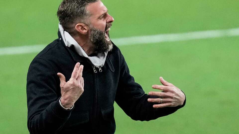 Houston Dynamo head coach Ben Olsen coaches from the sidelines during the second half of an MLS Western Conference semifinal soccer match against Sporting Kansas City on Sunday, Nov. 26, 2023 in Houston. The Dynamo advanced to the MLS Western Conference Finals with a 1-0 win.