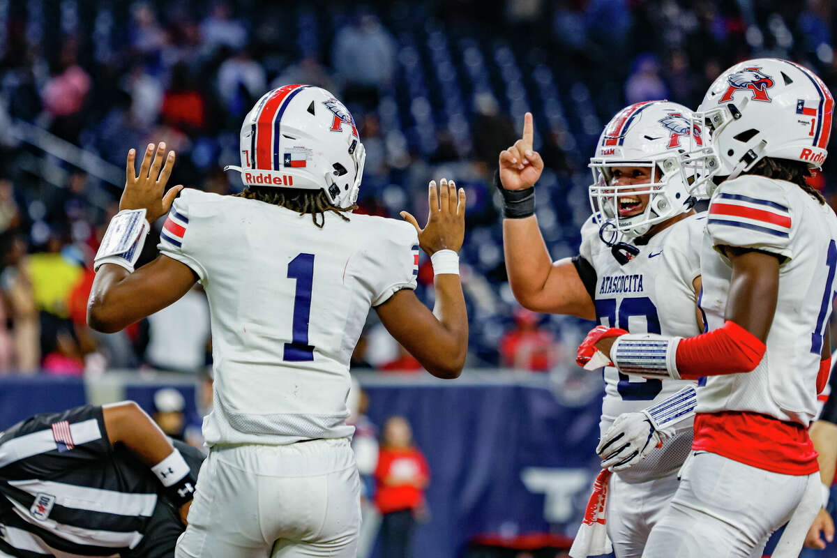 Atascocita players celebrate during a Texas high school football playoff game against Lamar, Friday, November 24, 2023, at NRG Stadium in Houston.