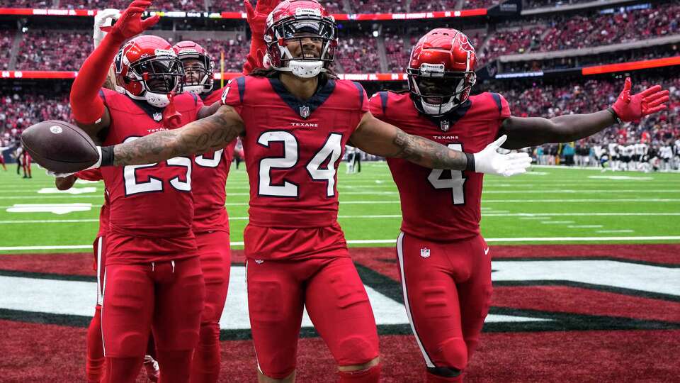 Houston Texans cornerback Derek Stingley Jr. (24) reacts after intercepting a pass by Jacksonville Jaguars quarterback Trevor Lawrence during the second half of an NFL football game Sunday, Nov. 26, 2023, in Houston.