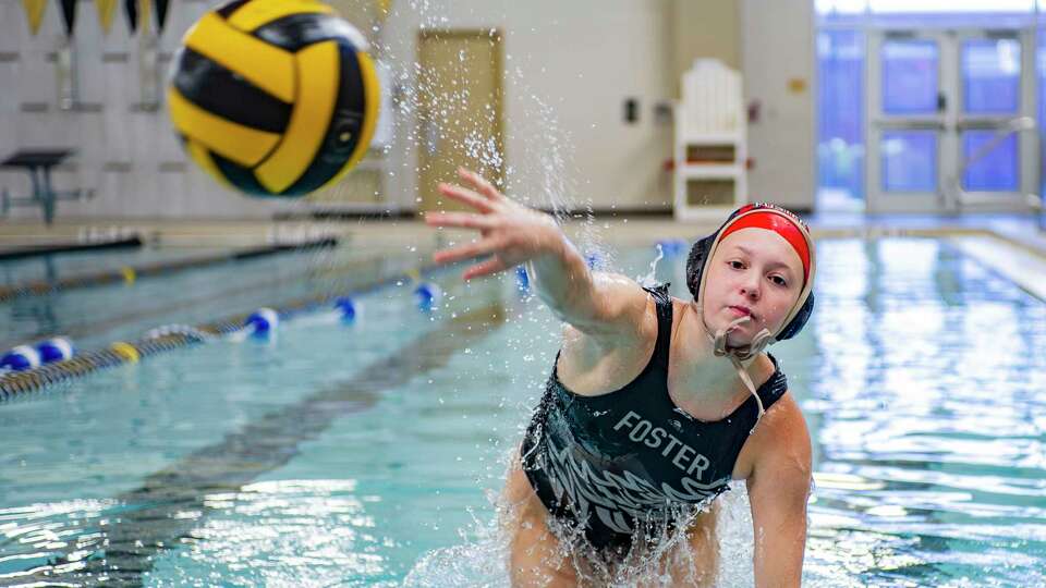 All-Greater Houston girls water polo player of the year, Foster's Clara McKee, demonstrates her scoring technique as she poses for a portrait in her school practice pool at Foster High School Tuesday, Nov. 28, 2023 in Richmond.