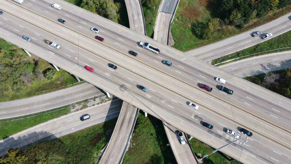 Vehicles make their way across the region as Interstate 45 crosses over Loop 610, Wednesday, Nov. 29, 2023, in Houston.