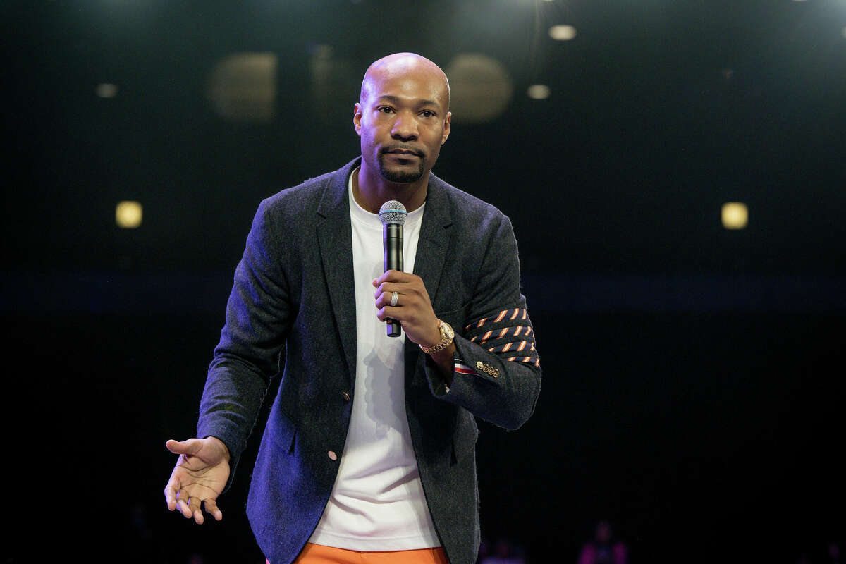 Pastor Keion Henderson speaks onstage during the CryOut Conference 2023 at George R. Brown Convention Center in Houston.