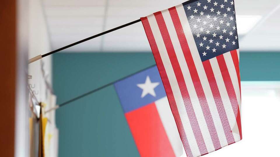 An American flag and a Texas state flag are photographed in a classroom on Monday, Nov. 27, 2023 at Gregg Elementary School in Houston.