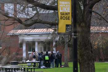 A group of students gather on the Saint Rose campus on Friday, Dec. 1, 2023, a day after news about the college closing broke in Albany, NY.