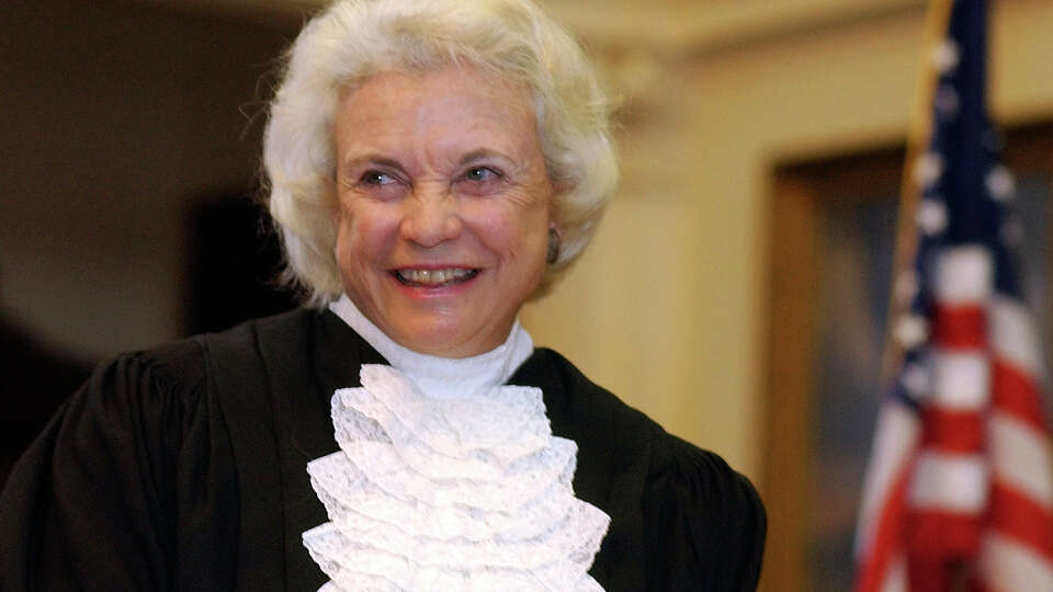 FILE - Supreme Court Justice Sandra Day O'Connor is shown before administering the oath of office to members of the Texas Supreme Court in Austin, Texas, on Jan. 6, 2003. For more than a decade, O'Connor was the only woman on the Supreme Court. And she was the first. Now the court has a record four.