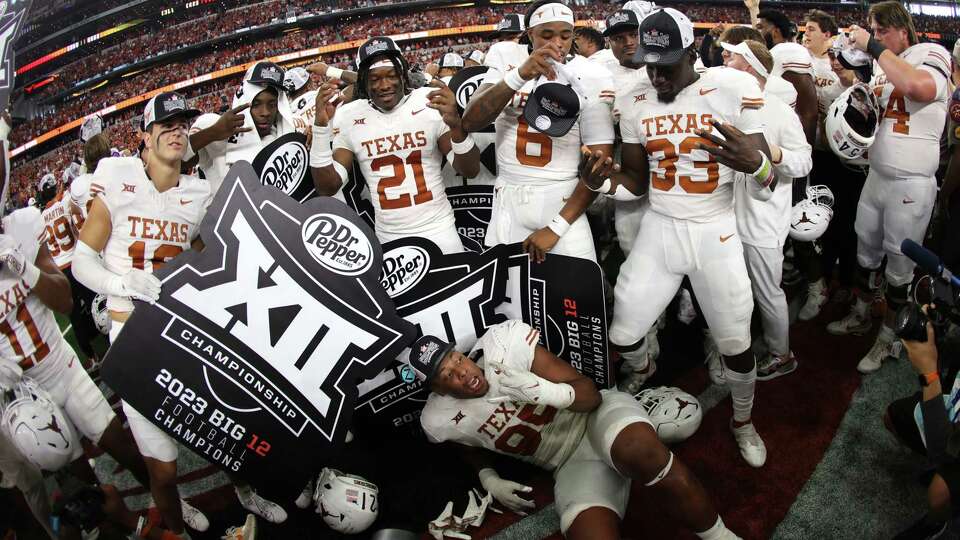 ARLINGTON, TX - DECEMBER 2: The Texas Longhorns Celebrate after defeating the Oklahoma State Cowboys in the Big 12 Championship at AT&T Stadium on December 2, 2023 in Arlington, Texas.