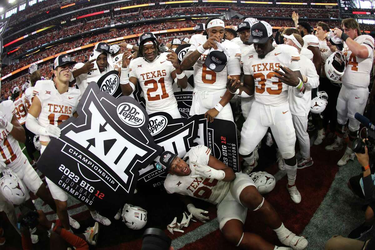 ARLINGTON, TX - DECEMBER 2: The Texas Longhorns Celebrate after defeating the Oklahoma State Cowboys in the Big 12 Championship at AT&T Stadium on December 2, 2023 in Arlington, Texas.