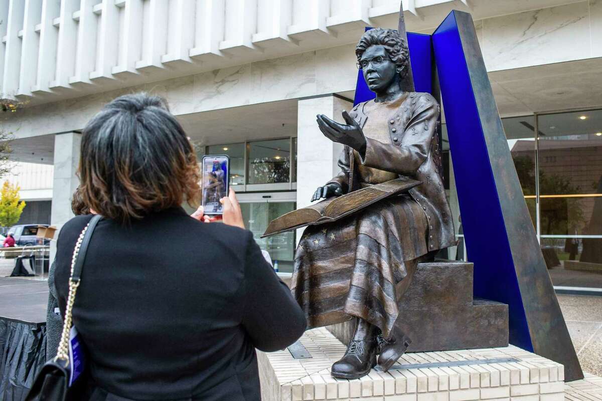 Kim Taylor admires the monument modeled in the image of politician and civil rights activist Barbara Jordan following a dedication and unveiling ceremony Saturday, Dec. 2, 2023 in Houston.