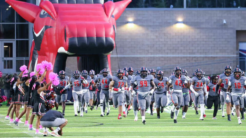 Westfield Mustang players take the field prior to a District 14-6A football game between the Nimitz Cougars and the Westfield Mustangs at Planet Ford Stadium in Spring, TX on Friday, October 6, 2023.