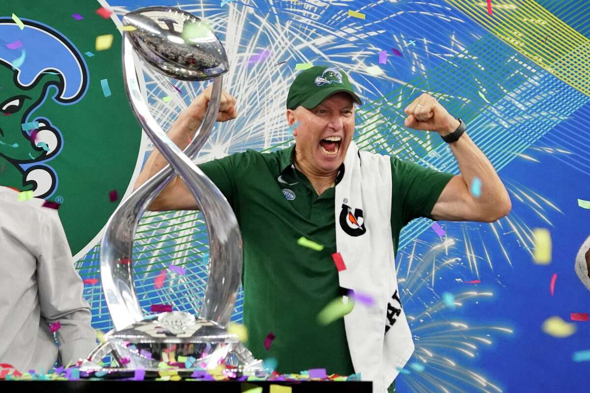 Tulane head coach Willie Fritz celebrates with the trophy after the Cotton Bowl NCAA college football game against Southern California, Monday, Jan. 2, 2023, in Arlington, Texas.