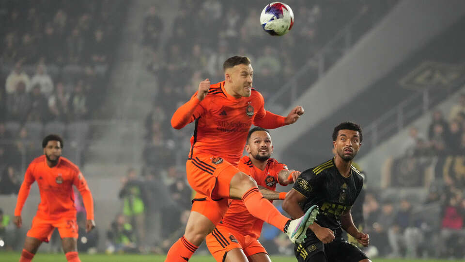 Houston Dynamo defender Erik Sviatchenko heads the ball during the first half in the MLS playoff Western Conference final soccer match against Los Angeles FC, Saturday, Dec. 2, 2023, in Los Angeles. (AP Photo/Marcio Jose Sanchez)