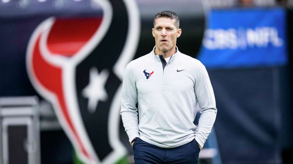 Houston Texans general manager Nick Caserio walks on the field before an NFL football game against the Denver Broncos Sunday, Dec. 3, 2023, in Houston.