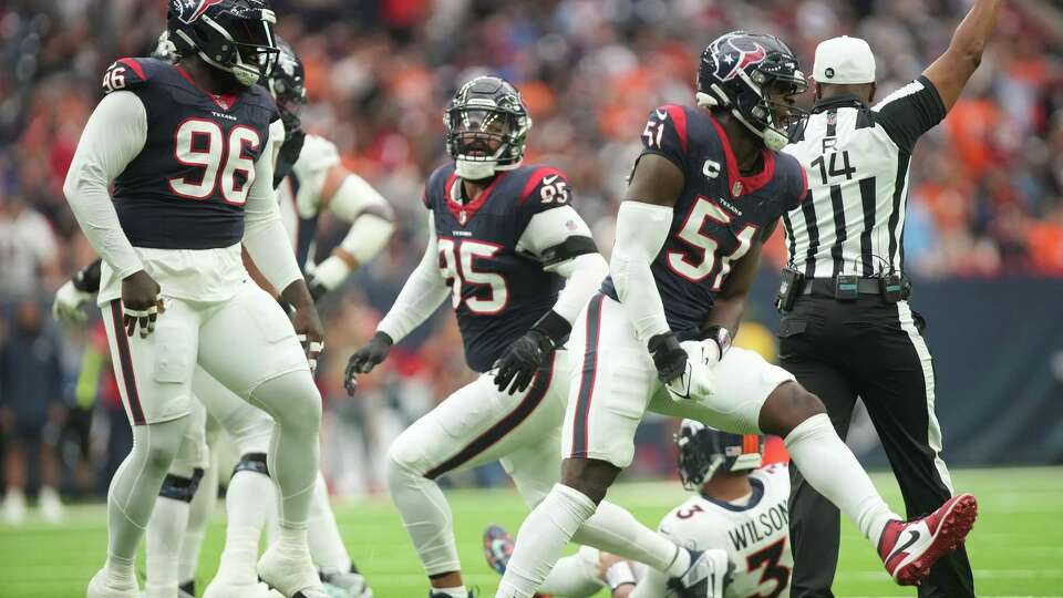 Houston Texans defensive end Will Anderson Jr. (51) reacts to sacking Denver Broncos quarterback Russell Wilson (3) in the first half of NFL game action at NRG Stadium on Sunday, Dec. 3, 2023 in Houston.