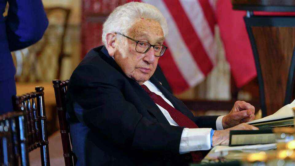 FILE - Former U.S. Secretary of State Henry Kissinger attends a luncheon with French President Emmanuel Macron, Vice President Kamala Harris and Secretary of State Antony Blinken, Thursday, Dec. 1, 2022, at the State Department in Washington. The former secretary of state exerted uncommon influence on global affairs under Presidents Richard Nixon and Gerald Ford, earning both vilification and the Nobel Peace Prize died Nov. 29, 2023.