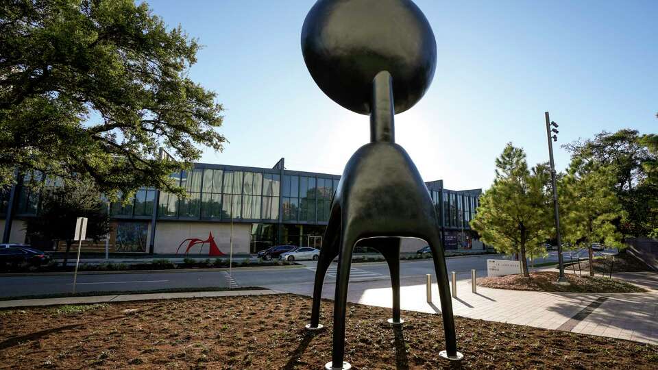 Simone Leigh's towering, 24-foot-high bronze sculpture Satellite has been installed outside at the Nancy and Rich Kinder Building at Museum of Fine Arts, Houston on Monday, Dec. 4, 2023 in Houston. Weighing nearly 6,000 pounds, Satellite is comprised of two elements: a torso with four supports and a disc-like head. The MFAH is the first U.S. museum to acquire an edition of this monumental bronze and install the work in a permanent display.