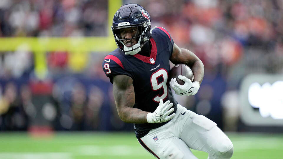 Houston Texans tight end Brevin Jordan (9) carries the ball against the Denver Broncos in the second half of an NFL football game Sunday, Dec. 3, 2023, in Houston. (AP Photo/Eric Gay)