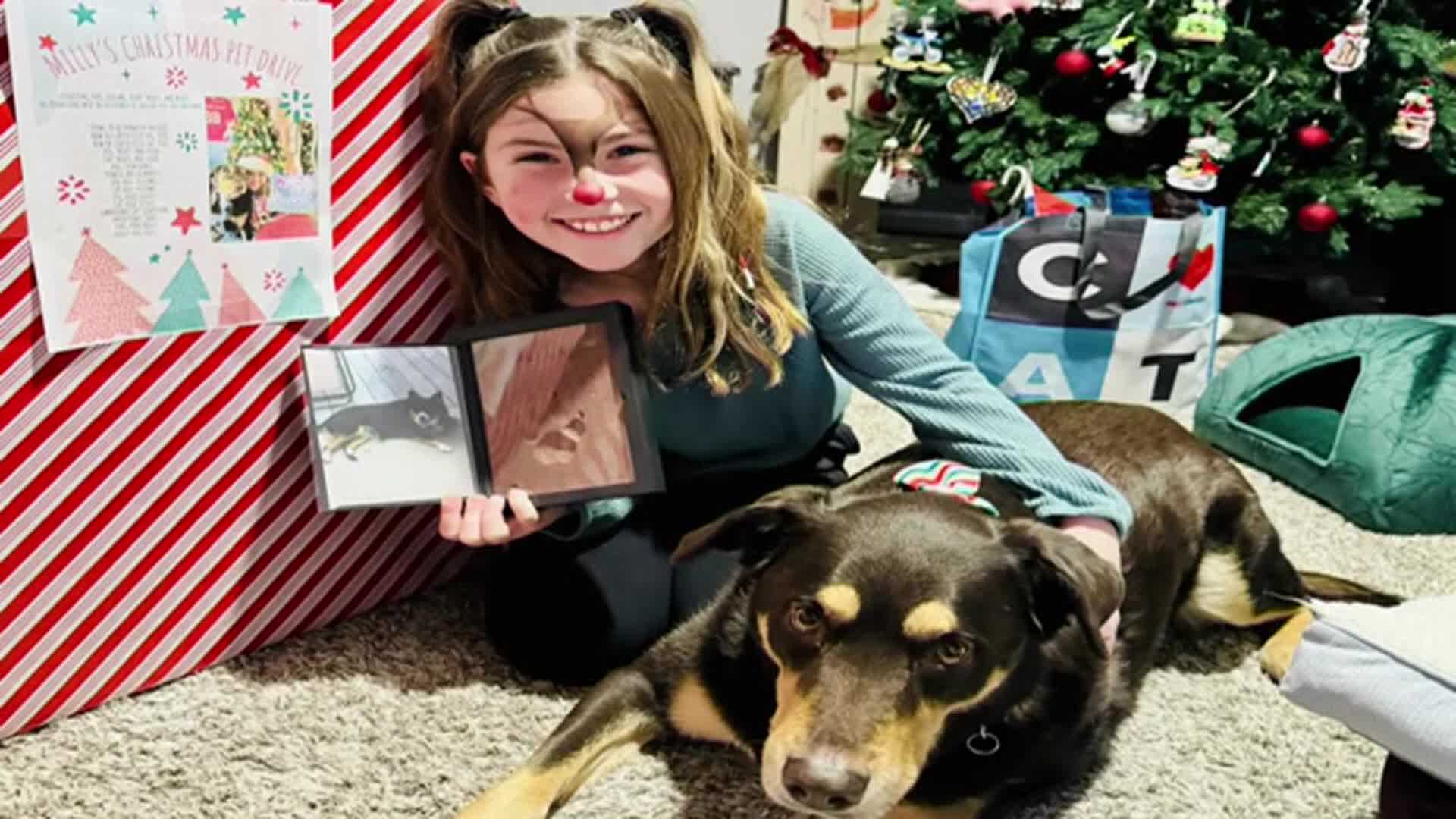 To honor of her dog who died at Christmastime, a 9-year-old girl holds ...