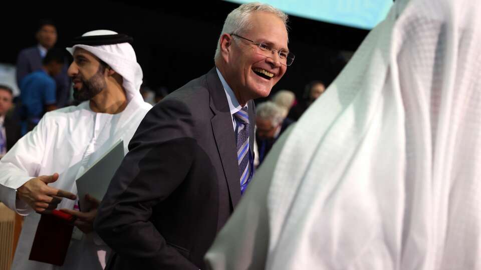 Darren Woods, chairman and chief executive officer of Exxon Mobil Corp, during the Summit on Methane and Other Non-CO2 Greenhouse Gases on day three of the COP28 climate conference at Expo City in Dubai, United Arab Emirates, on Saturday, Dec. 2, 2023. More than 70,000 politicians, diplomats, campaigners, financiers and business leaders will fly to Dubai to talk about arresting the world's slide toward environmental catastrophe. Photographer: Hollie Adams/Bloomberg