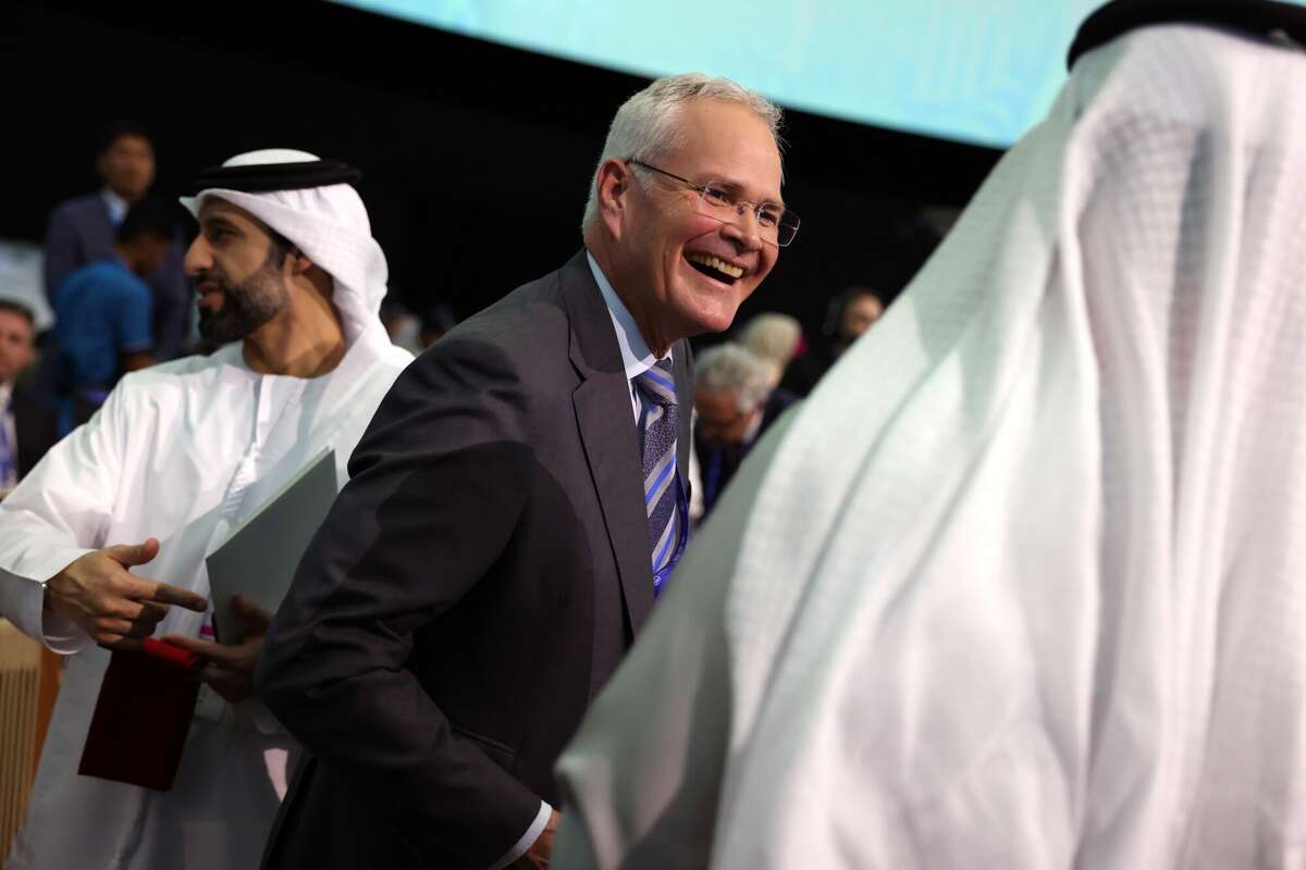 Darren Woods, chairman and chief executive officer of Exxon Mobil Corp, during the Summit on Methane and Other Non-CO2 Greenhouse Gases on day three of the COP28 climate conference at Expo City in Dubai, United Arab Emirates, on Saturday, Dec. 2, 2023. More than 70,000 politicians, diplomats, campaigners, financiers and business leaders will fly to Dubai to talk about arresting the world's slide toward environmental catastrophe. Photographer: Hollie Adams/Bloomberg