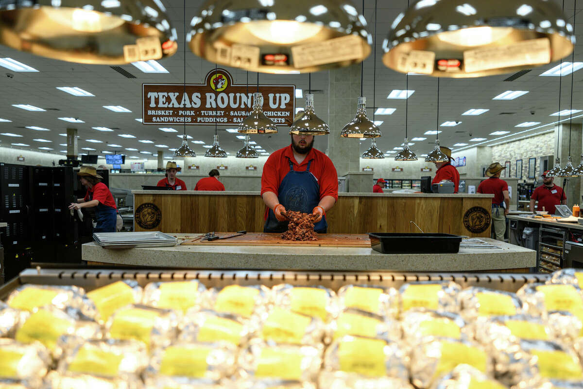 Sauce is mixed in with the fresh smoked brisket at the Texas Round Up station at the nation's largest Buc-ee's in Sevierville, Tenn. 