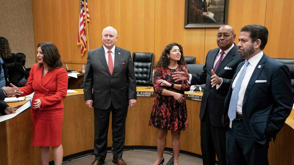 Harris County Commissioners, from left, Lesley Briones, Tom Ramsey, Judge Lina Hidalgo, Rodney Ellis and Adrian Garcia stand as they get ready to take photos with those honored during the Commissioners Court meeting on Tuesday, Dec. 5, 2023 in Houston.
