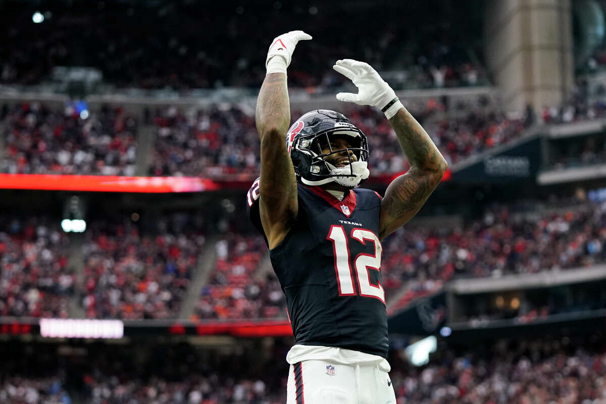 Nico Collins #12 of the Houston Texans celebrates after scoring a touchdown in the fourth quarter against the Denver Broncos at NRG Stadium on December 03, 2023 in Houston, Texas.