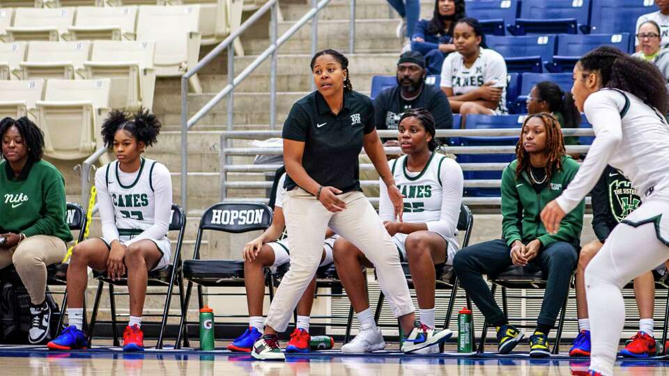 Hightower basketball coach Jasmine Brewer reacts in the first half of a high school girls basketball game against Fulshear Tuesday, Dec. 5, 2023 at Hightower High School.