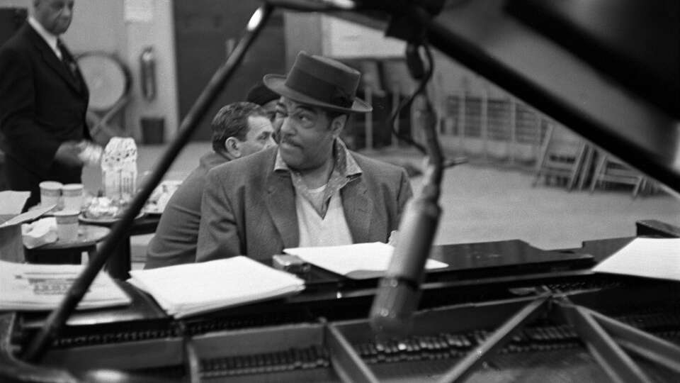 Duke Ellington, American composer, pianist, and jazz orchestra leader in rehearsal, May 18, 1956.